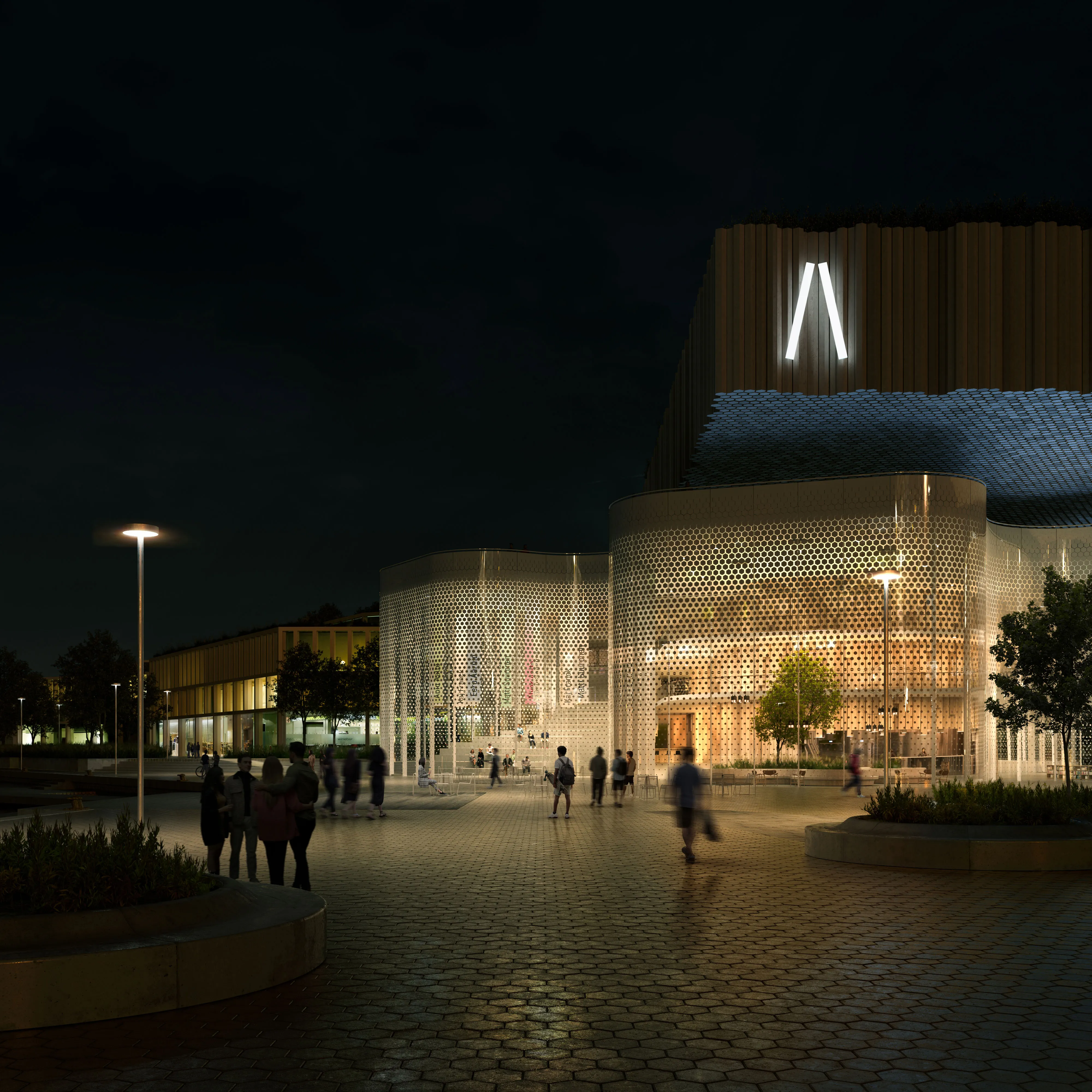 The Meltsinki museum in Helsinki at night, its perforated white drums glowing under a timber-clad upper volume.