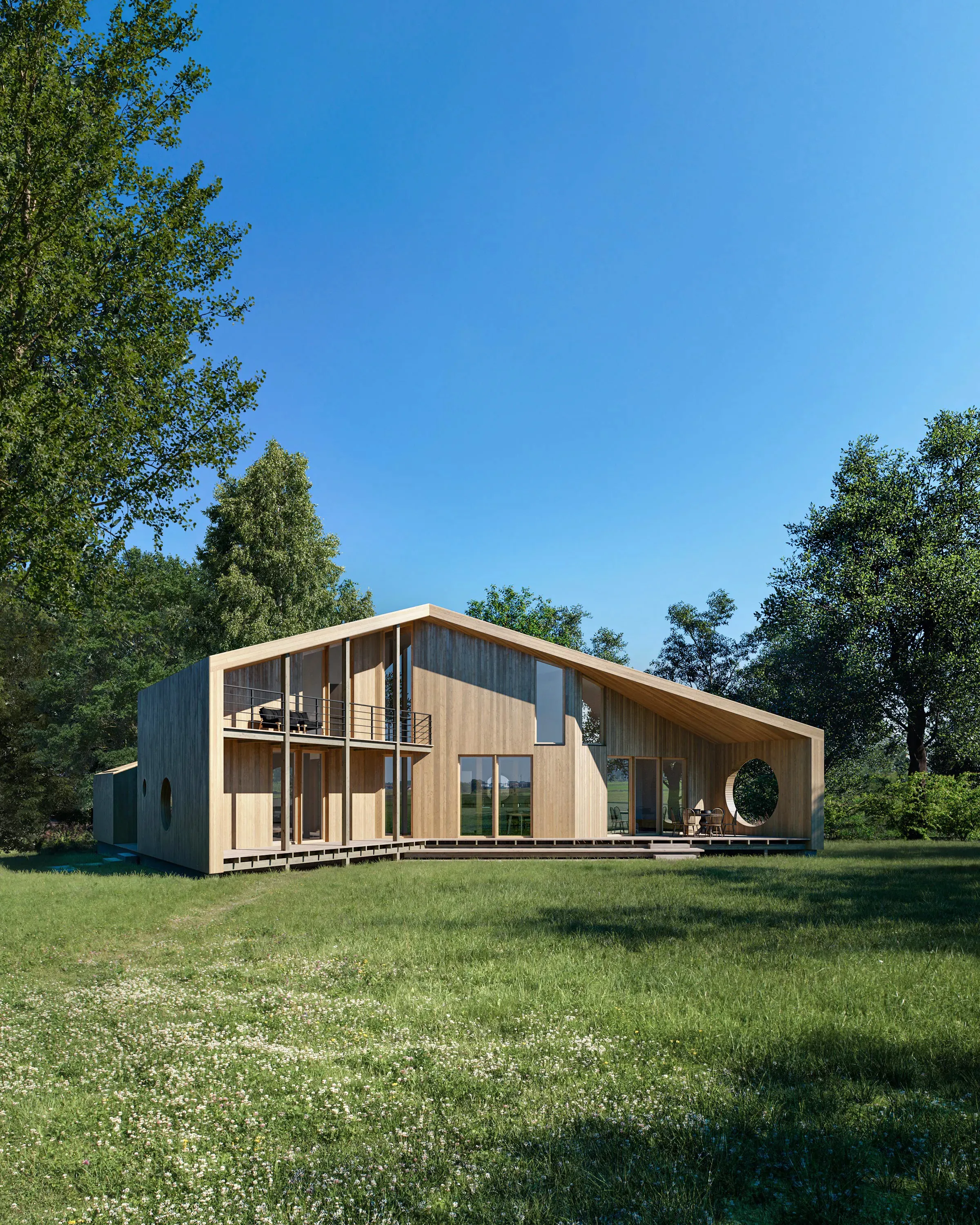 The Wing House in a summer meadow, its pale timber volume under a long sweeping roof with a round window at one end.