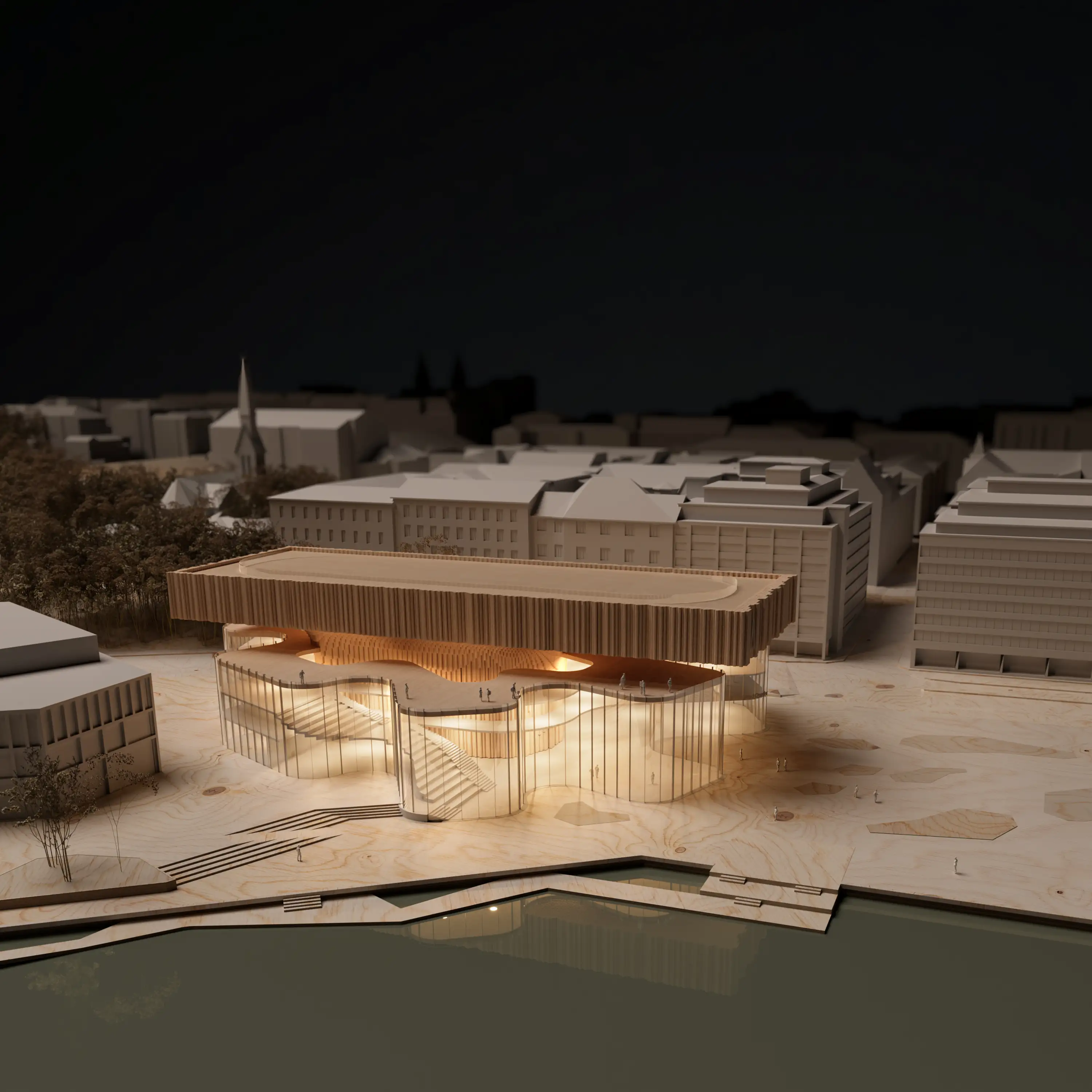 Illuminated physical model of the Meltsinki museum in its Helsinki waterfront context at night.