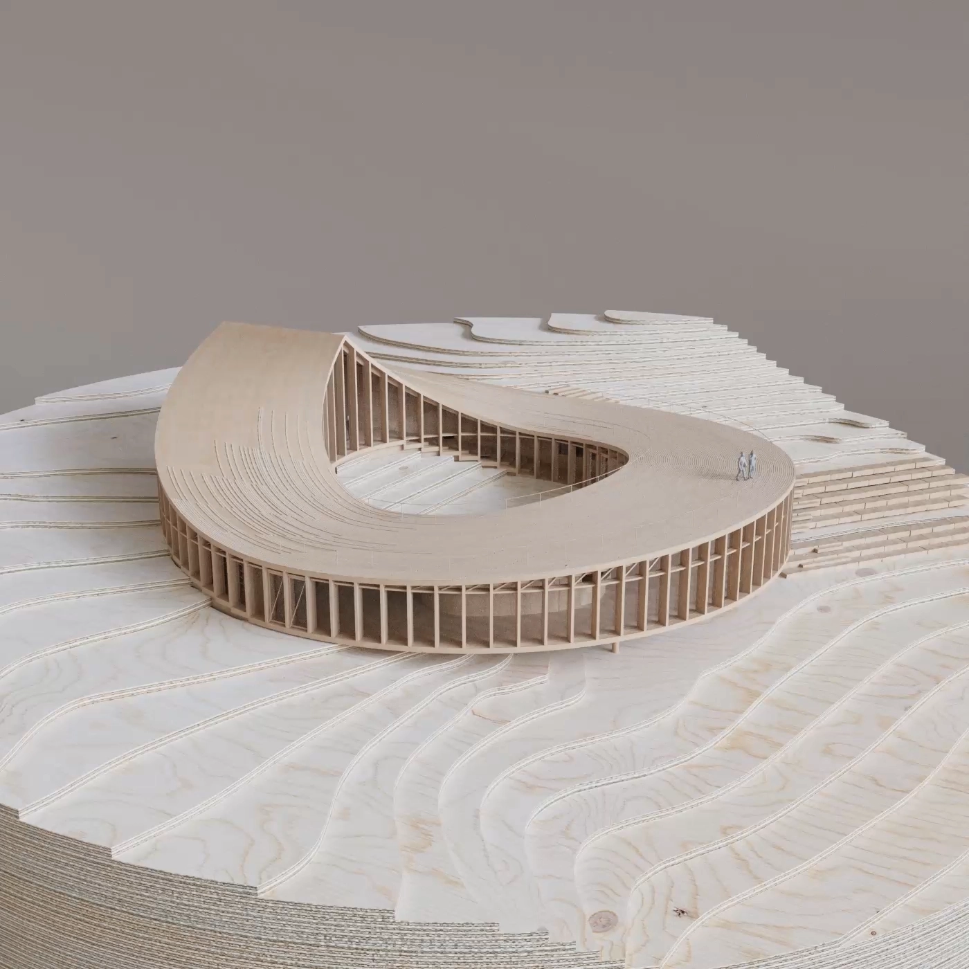 Aerial view of a physical model of the Nest visitor centre on layered contour terrain.