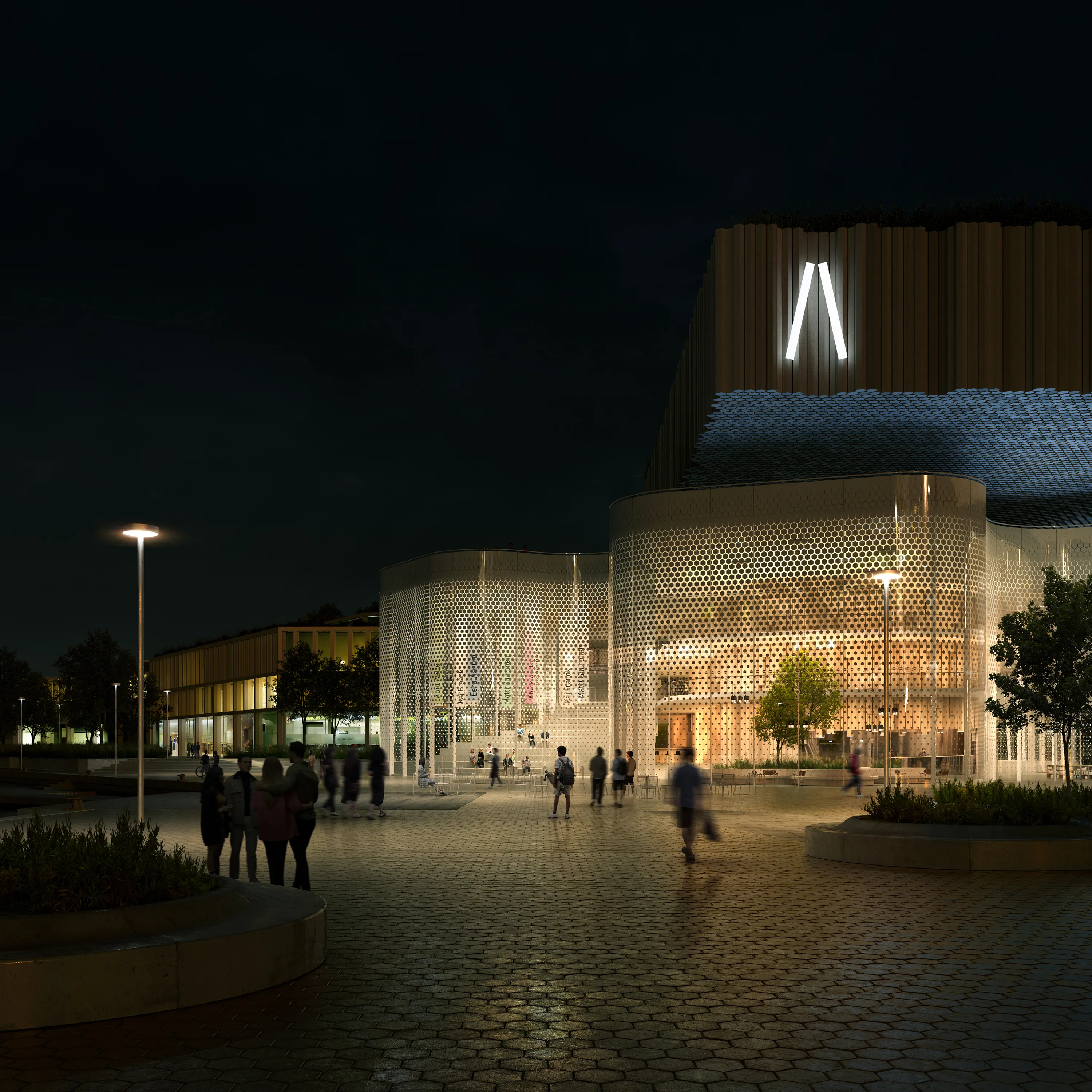 Night view of a luminous cultural building with people outside.
