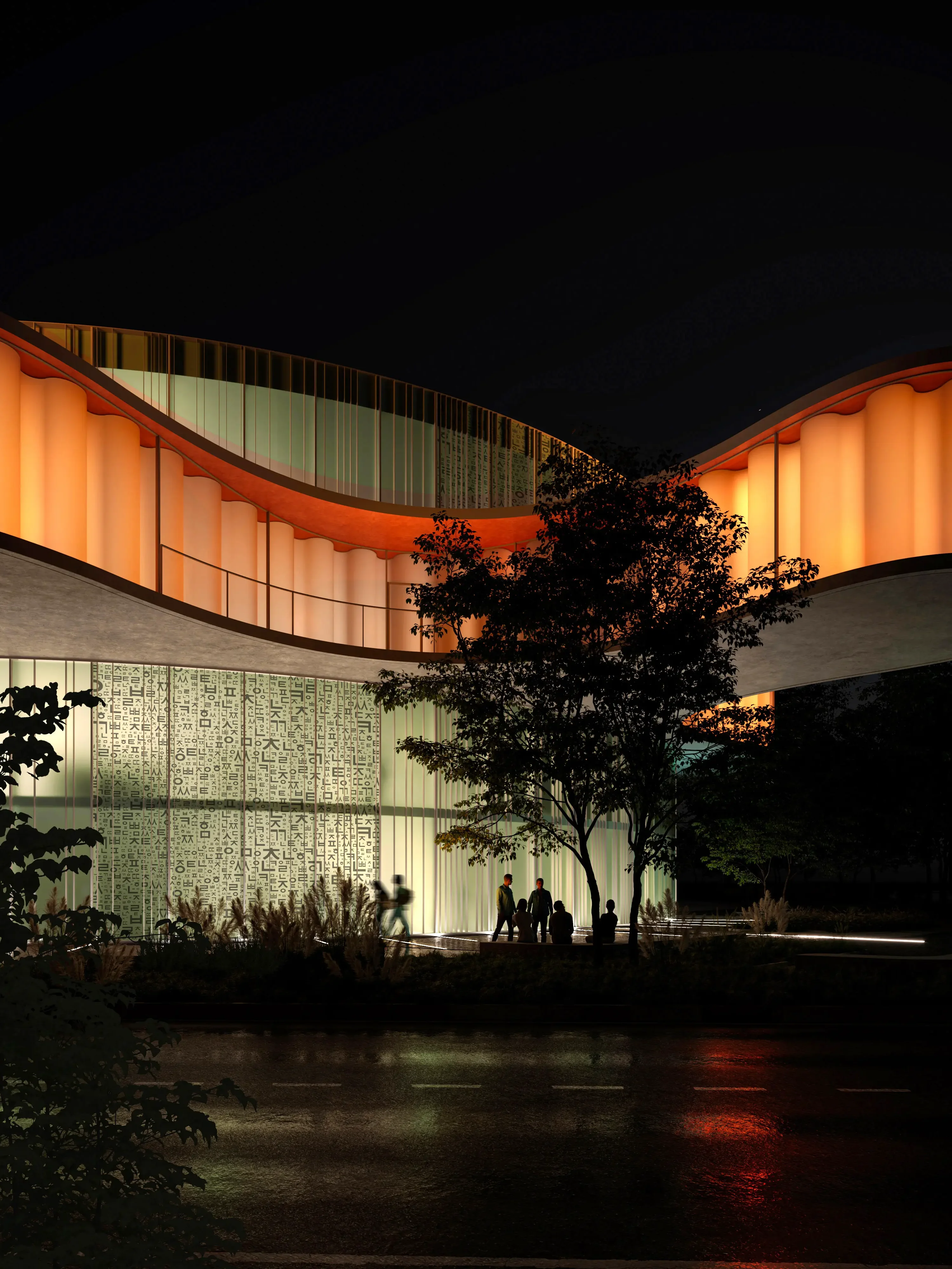 Warmly lit public building reflected on wet ground at night.