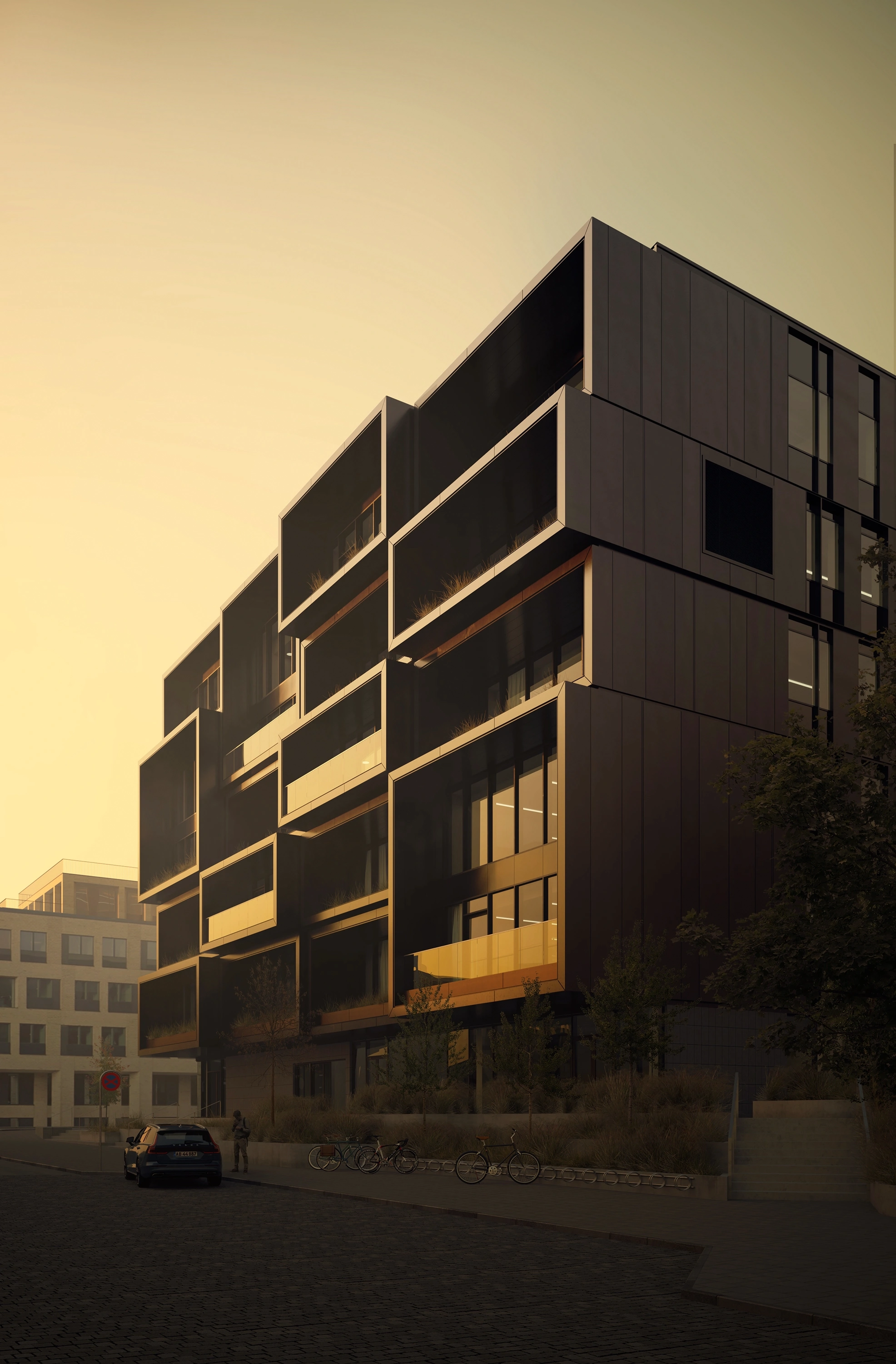Dark urban apartment building glowing in late afternoon light.